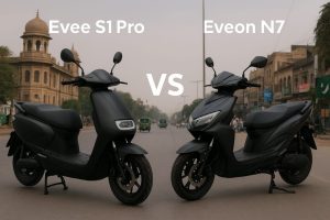 Comparison of two black electric scooties, Evee S1 Pro on the left and Eveon N7 on the right, parked on a city street in Pakistan.