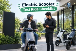 Rider on e-scooter receiving guidance for an Electric Scooter Test Ride Checklist.